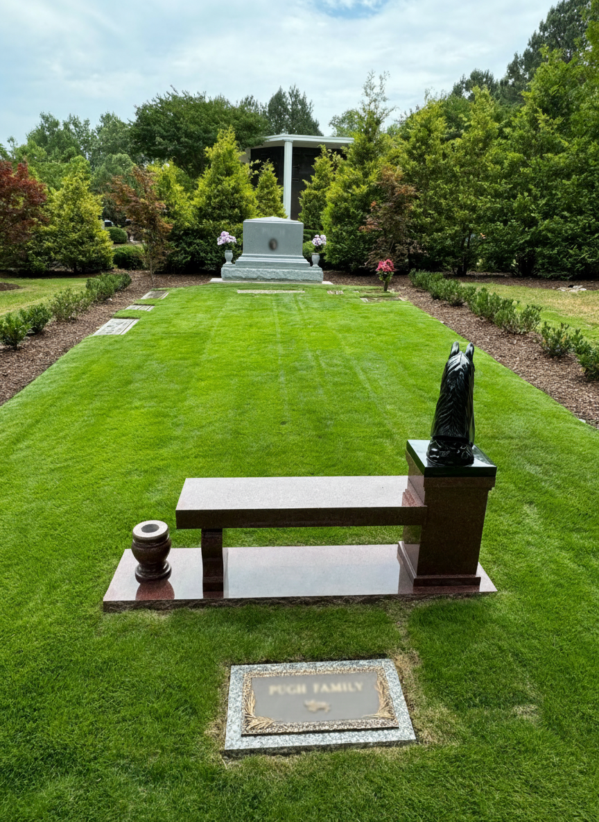 Peaceful memorial park with neatly mowed grass and carefully trimmed grounds around headstones in North Carolina