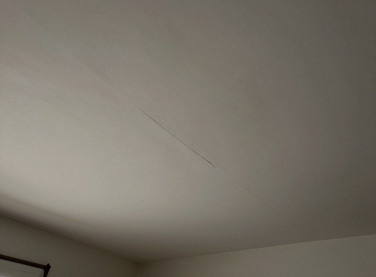 Ceiling crack in an older Union City NJ apartment before repair