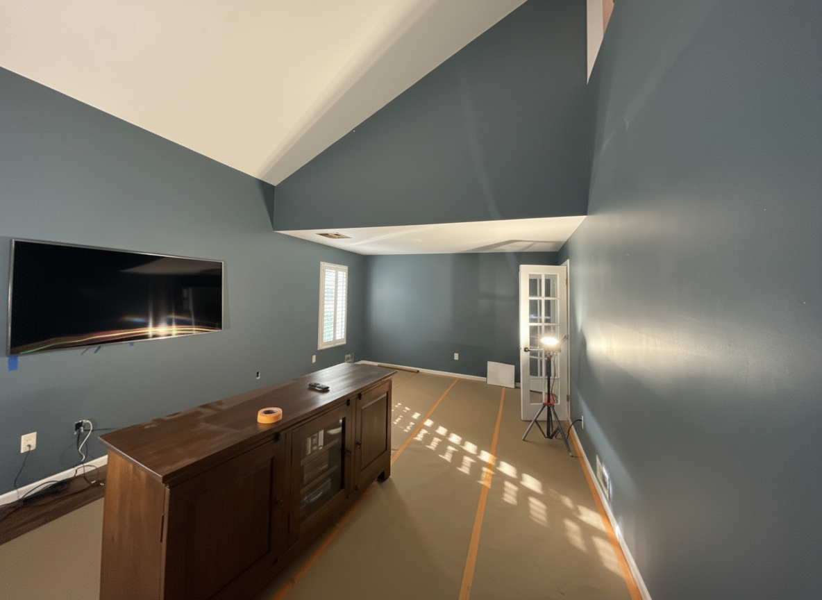 Fort Lee living room before painting - dark slate blue walls with vaulted ceiling