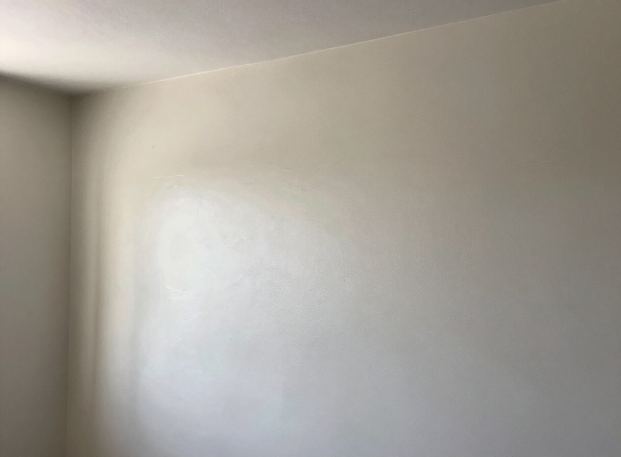 Skim-coated wall after sanding in a North Bergen NJ home, ready for primer