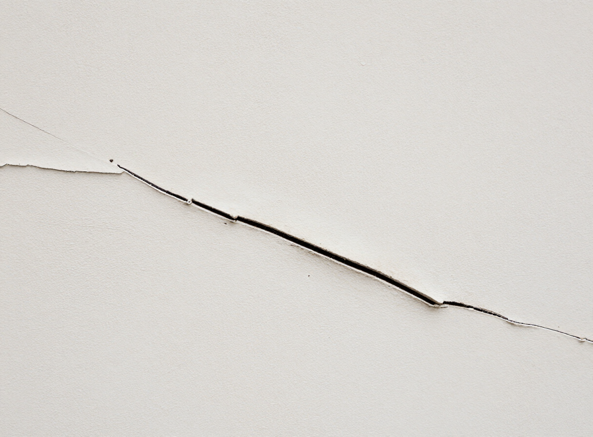 Close-up of a hairline crack in old plaster in a Hoboken NJ brownstone