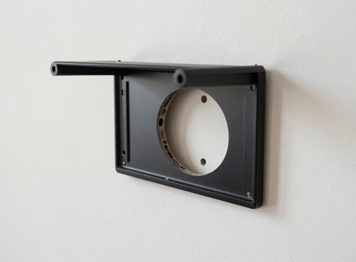 TV-mount hole in a Hoboken NJ apartment wall before repair