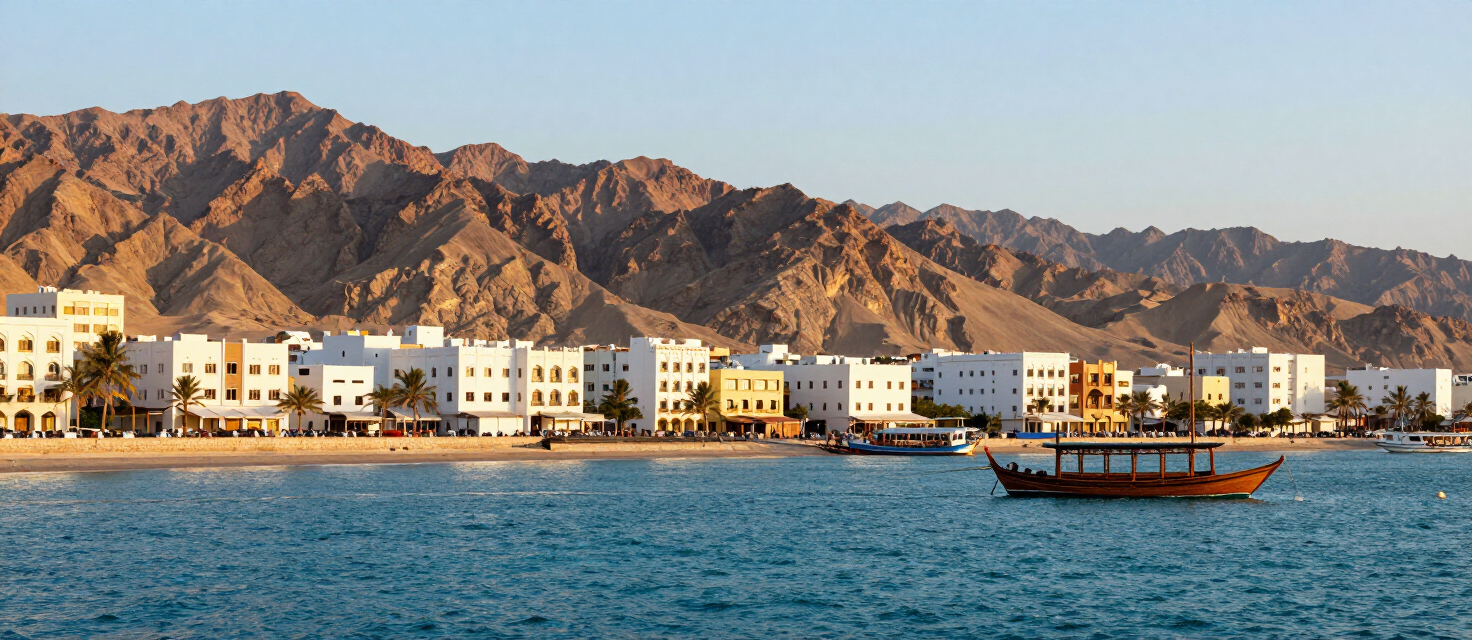 The Muscat corniche at golden hour with a traditional dhow in the harbor