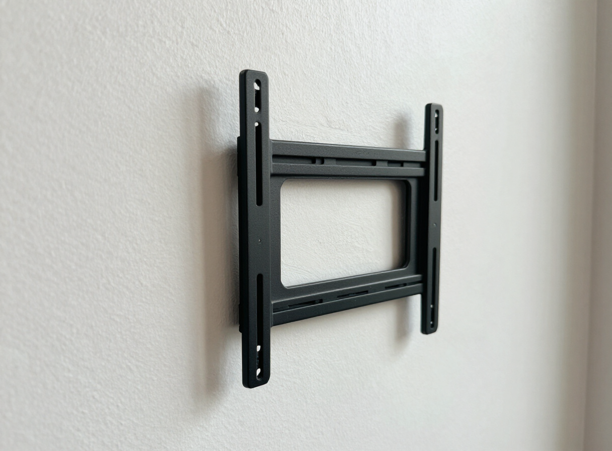 Repaired TV-mount hole in a Hoboken NJ apartment wall after patching and priming