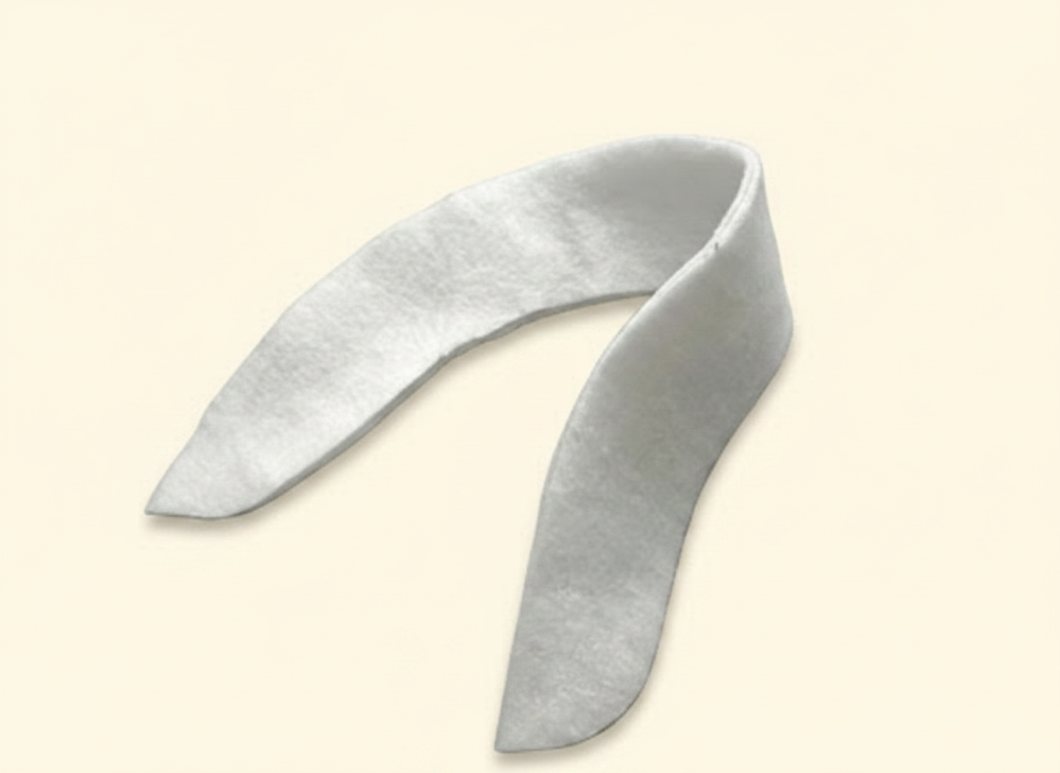 Assortment of custom pattern cut hair interlining components in various shapes